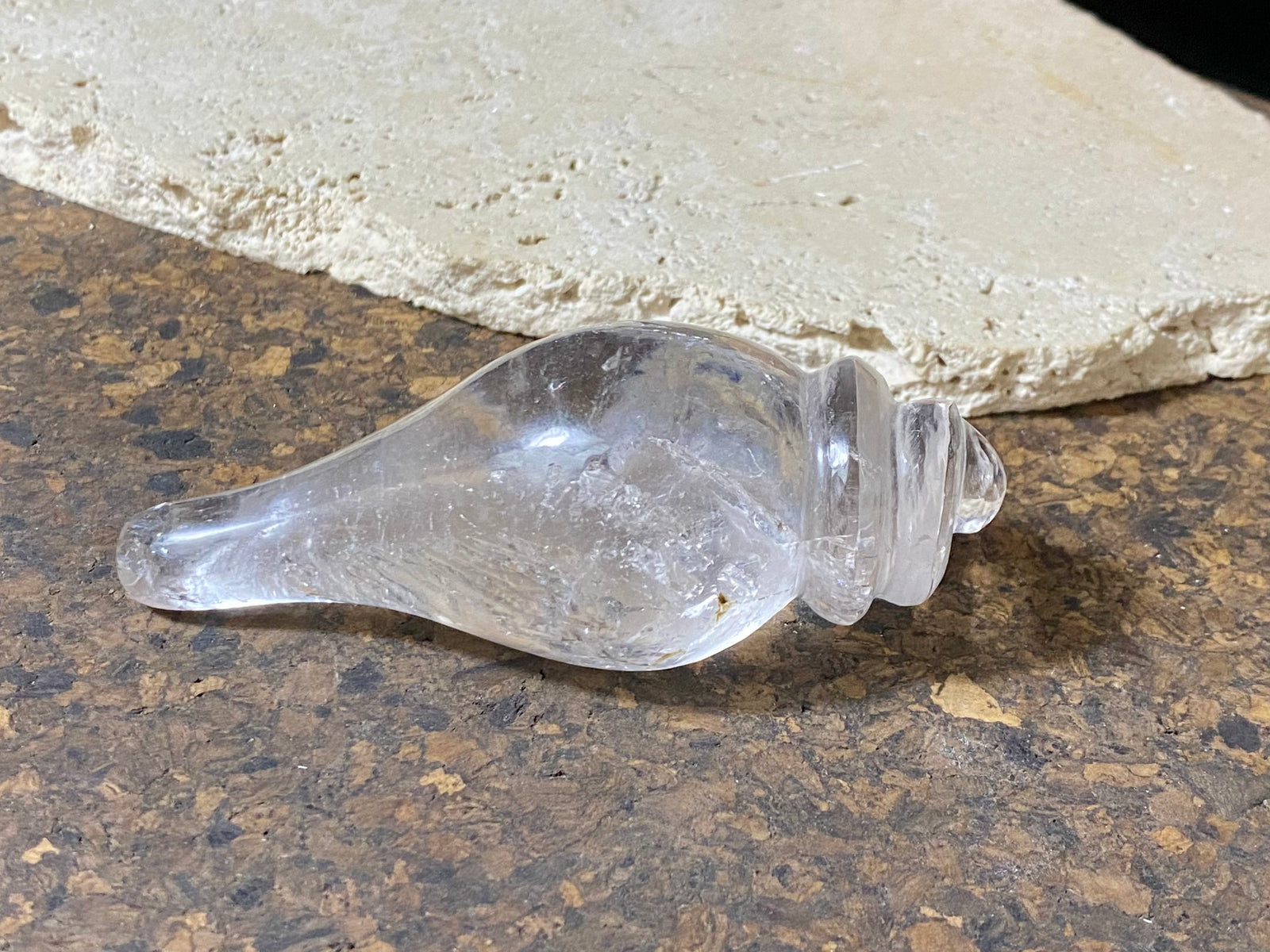 Hand carved conch shell. This vintage piece is carved from a solid piece of Himalayan rock crystal (quartz). The conch shell is sacred to both Hindus and Buddhists. Hand carved in Nepal. Measurements: length 10 cm, width at widest point 4.5 cm