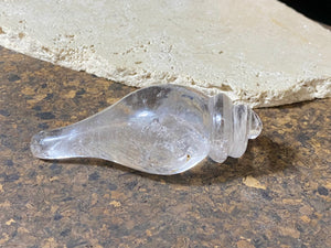 Hand carved conch shell. This vintage piece is carved from a solid piece of Himalayan rock crystal (quartz). The conch shell is sacred to both Hindus and Buddhists. Hand carved in Nepal. Measurements: length 10 cm, width at widest point 4.5 cm