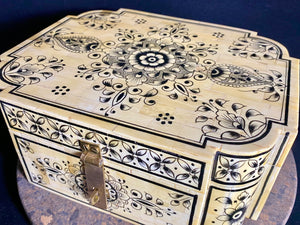 A beautiful rectangular hinged and lidded box crafted from hand shaped panels of camel bone over wood, which is then exquisitely hand painted. Hand made in Rajasthan, India. Measurements: width 25.5 x depth 20.5 cm, height 10.5 cm.