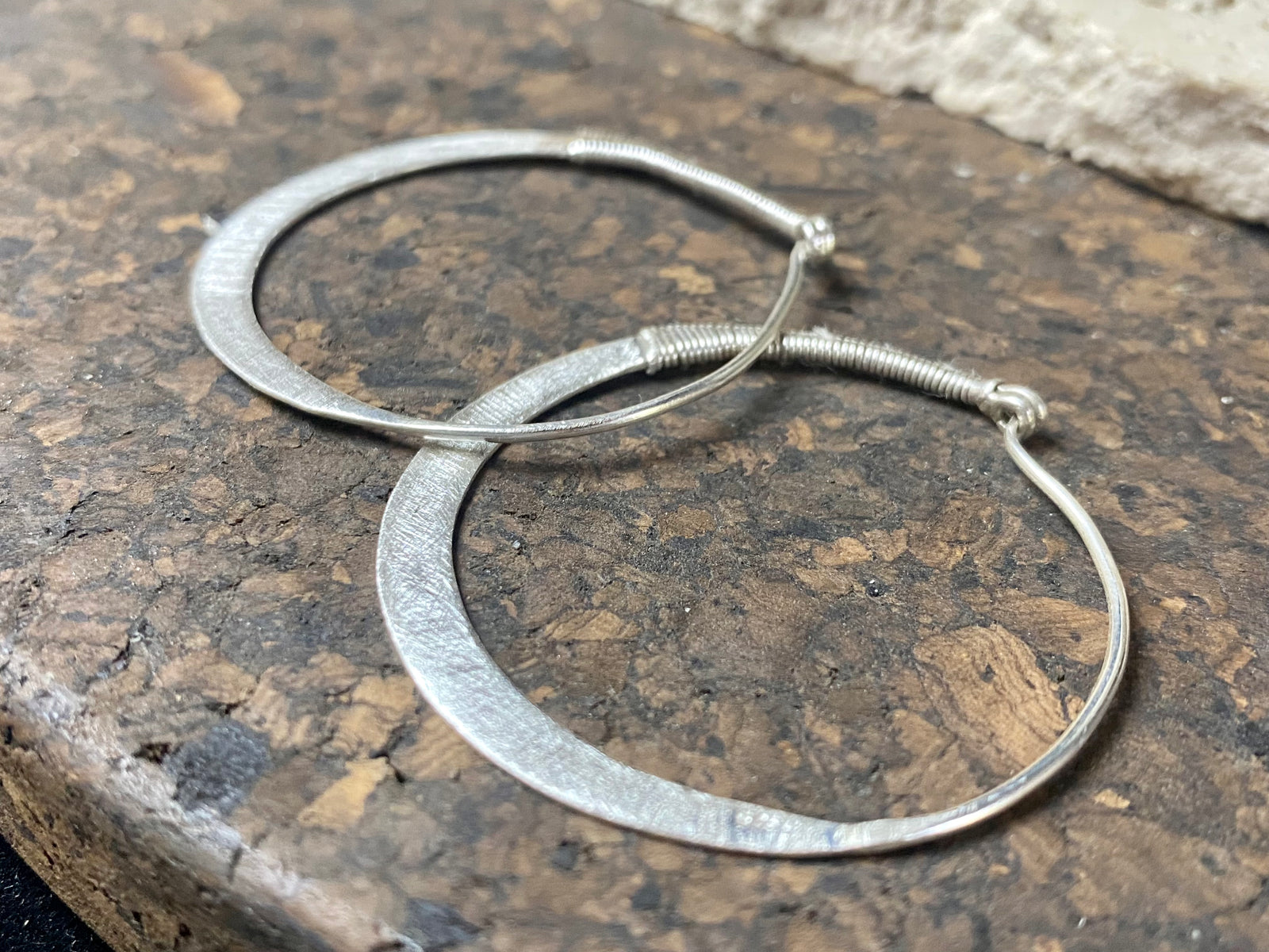 Hand made tribal sterling silver hoop earrings with wrapped silver wire detailing. 4.5 cm diameter