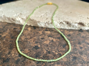 Natural clear green peridot bead necklace. Brass screw clasp. Length 37 cm