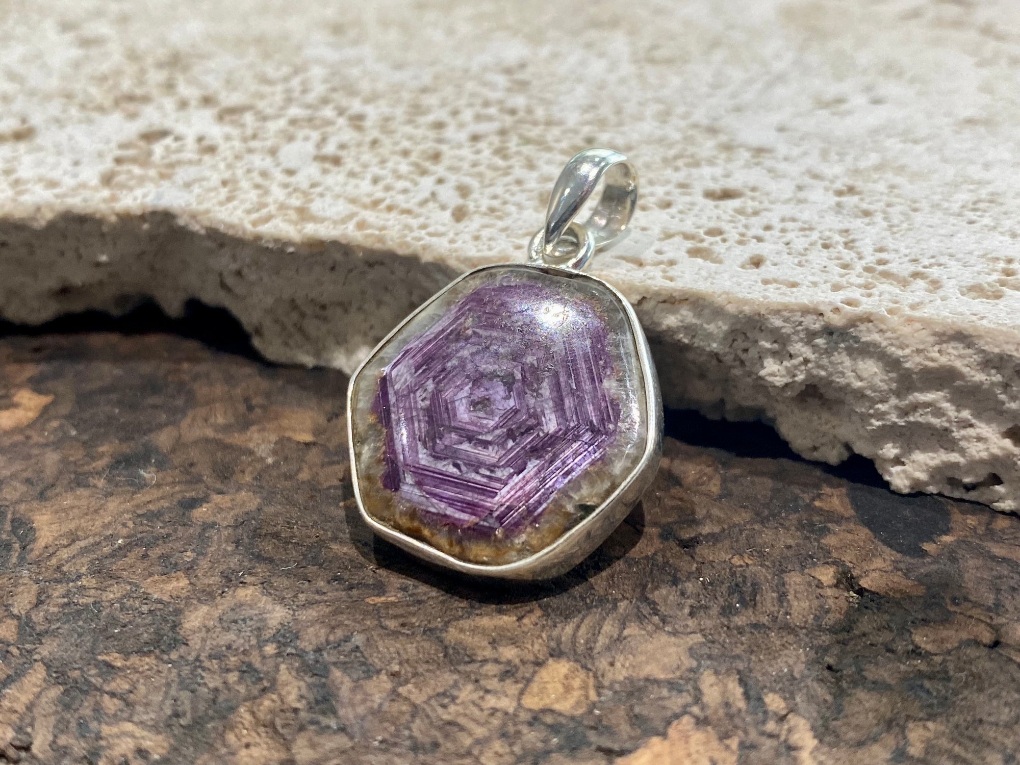 Trapiche ruby pendant with the very desirable hexagonal growth pattern, surrounded by a border of natural quartz and set in sterling silver. Height including bail 3.3 cm, width 2.2 cm