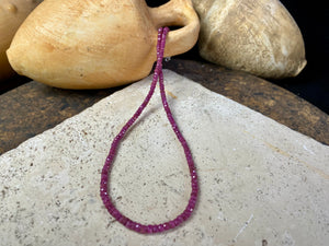 Beaded ruby necklace made up of finely graduated, matched facet-cut natural rubies. The necklace is finished with a sterling silver lobster clasp. This is a unisex necklace - perfect for men or women. Length 42 cm (16.5")