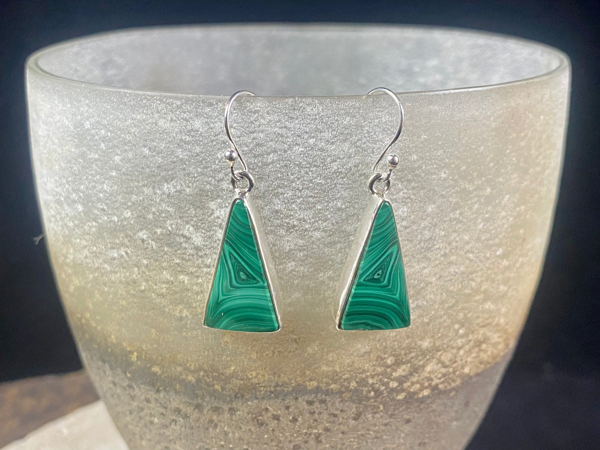 Our elegant earrings feature perfectly matched malachite cabochons set in sterling silver bezels. Finished with sterling silver hooks.