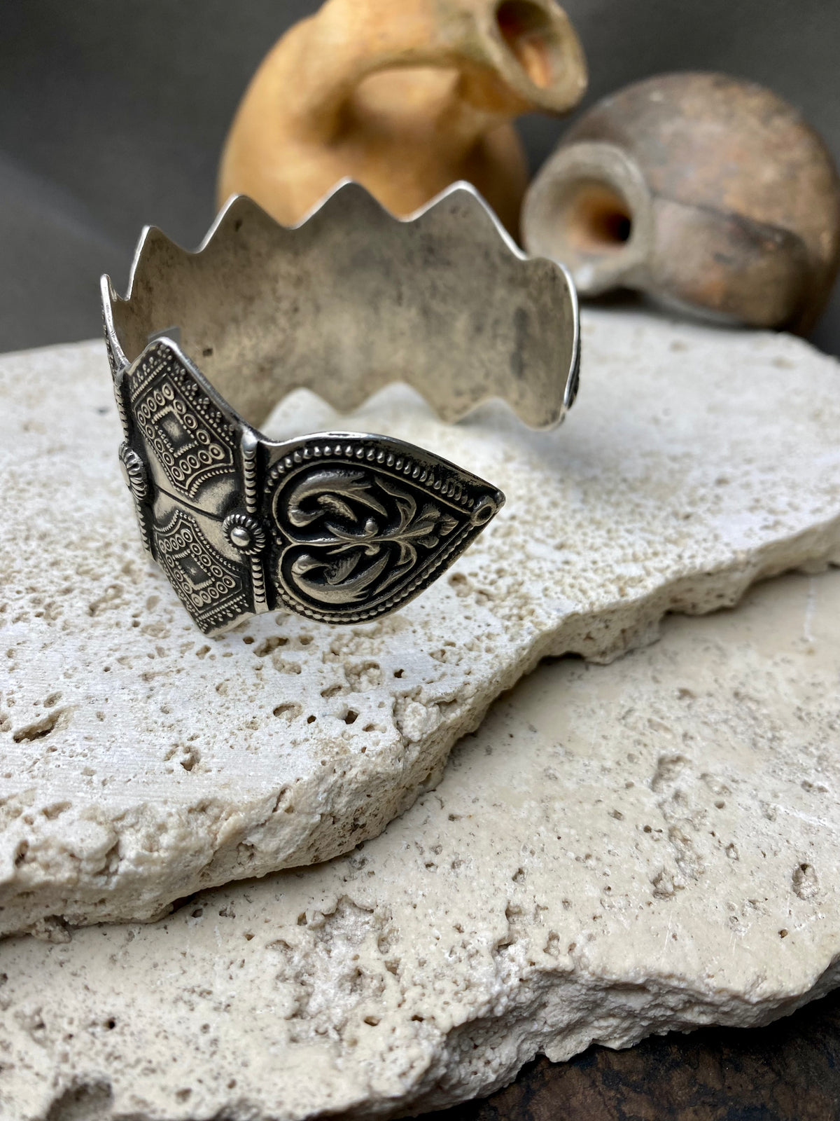 A modern interpretation of an antique style of bracelet, this piece is hand crafted from sterling silver by Rajasthani silversmiths. Exquistely detailed, the oxidised finish shows off the workmanship beautifully. There is some room for movement in this cuff, and it is designed to fit an average sized wrist.  Measurements: Inside opening is 6.5 cm, with room for expansion or contraction