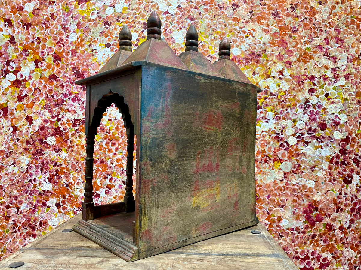 Solid timber shrine, nicho or display box, with three sections or bays,  beautifully carved and finished on three sides and inside with carved pillars, solid wood back, stepped up footing and peaked roof with finial. Most likely teak. Dates from the 1950-60s, southern India. Height 47.5 cm, depth 25 cm, width 38 cm