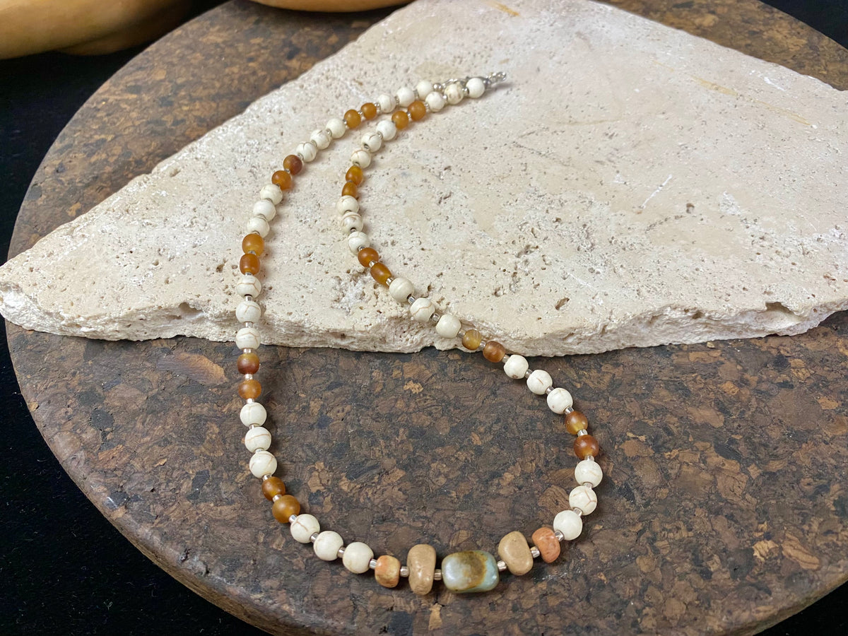 Our unique statement necklace features beautiful vintage beads from the Kashgar collection - turquoise centre bead, jasper beads from the Philippines, howlite beads, buffalo horn beads and  925 sterling silver detailing and lobster clasp. Length 45 cm.
