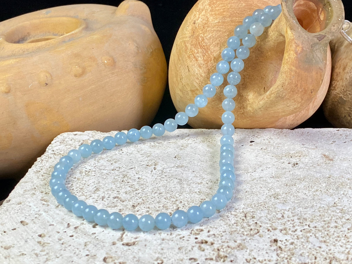 Natural aquamarine necklace featuring round aquamarine beads and a sterling silver clasp.   The aquamarines are matched a light and even blue of beautiful quality. Measurements: 47.5 cm