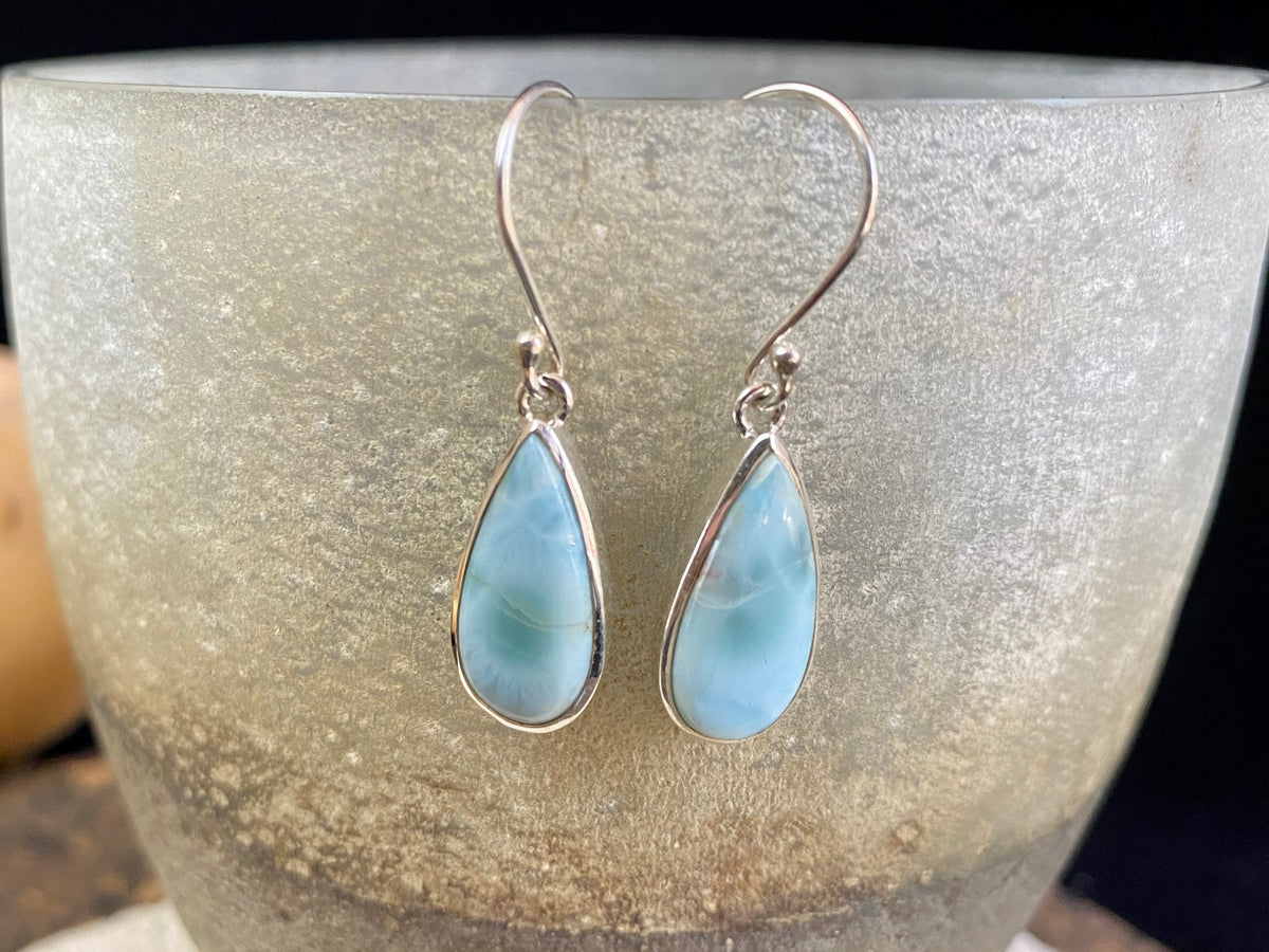 Larimar stone earrings set in sterling silver. Each pair of earrings is unique, cut and mounted to showcase the beauty of the individual stones.