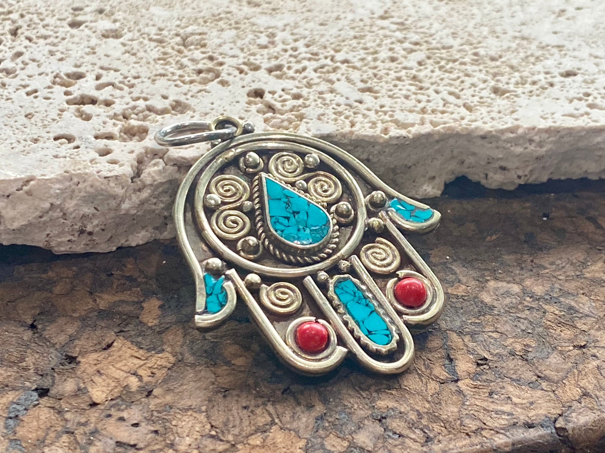 Beautiful hand made large hamsa pendant or charm set with ceramic turquoise and coral inserts. Non silver. Large bail for hanging. This is not just a piece for wearing around the neck. It can be hung anywhere you'd like it in the house. Height 5 cm
