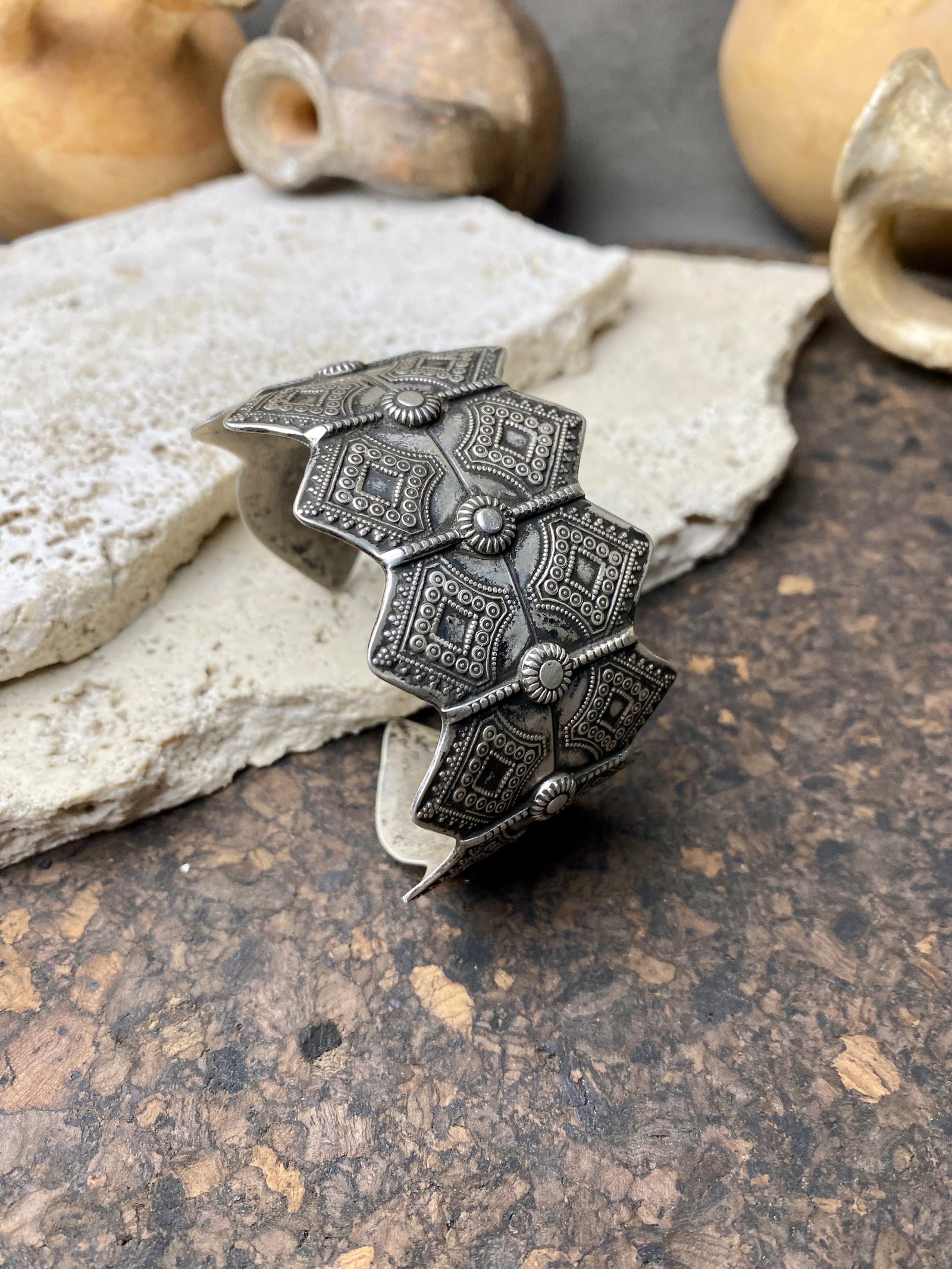 A modern interpretation of an antique style of bracelet, this piece is hand crafted from sterling silver by Rajasthani silversmiths. Exquistely detailed, the oxidised finish shows off the workmanship beautifully. There is some room for movement in this cuff, and it is designed to fit an average sized wrist.  Measurements: Inside opening is 6.5 cm, with room for expansion or contraction