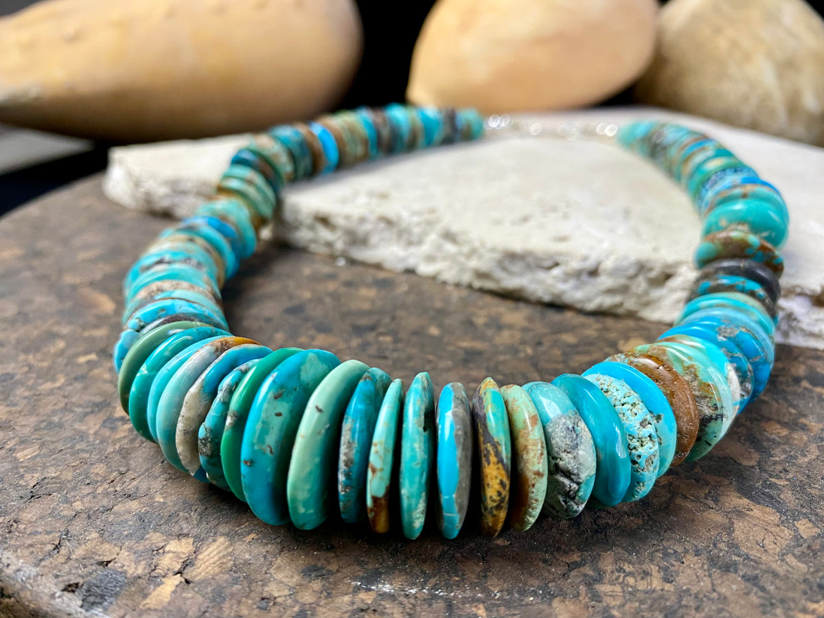 Stunning bright blue Arizona turquoise necklace featuring graduated disks of Arizona turquoise finished with sterling silver. Length 47.5 cm