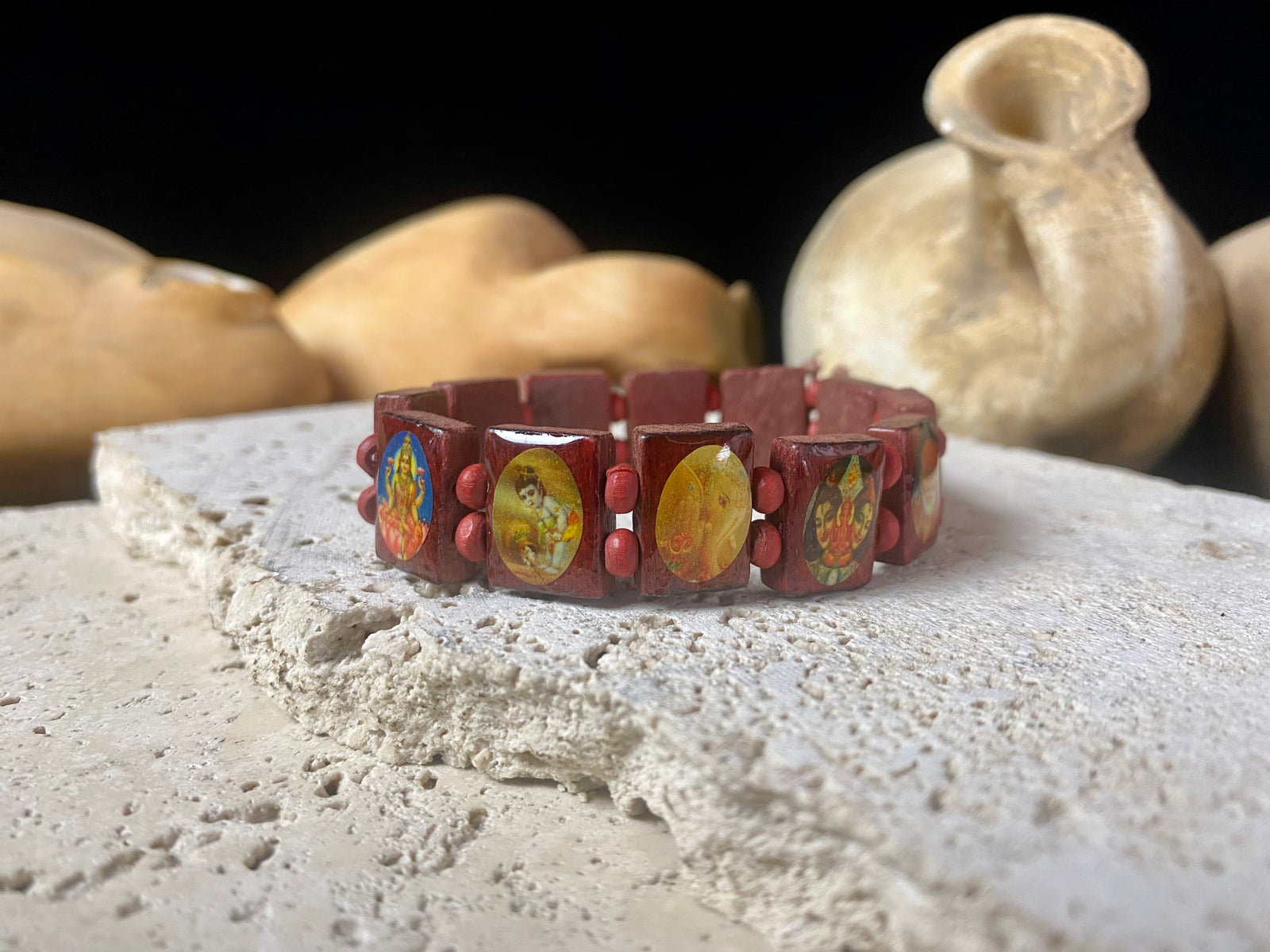 Simple, lightweight and fun, this elasticised bracelet is made up of small panels that feature images of various Hindu gods, including Lakshmi, Ganesh, Krishna and more. This is a great one for the kids, or if you'd simply like some universal protection.  Measurements: Panels 1.2 x 1.5 cm, inside bracelet circumference 15 cm.