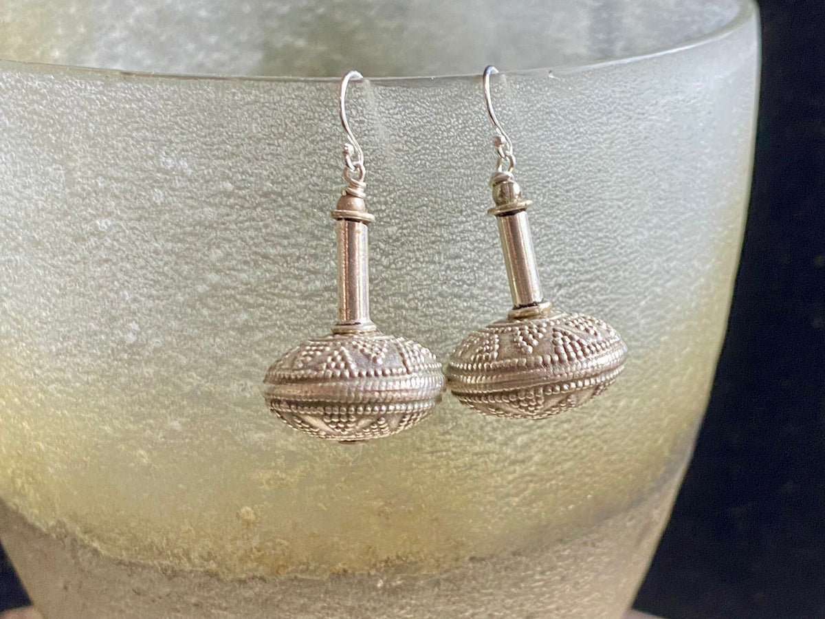 Get the look without the weight.  These earrings are big and impressive, but they are also lightweight and easy to wear. Why? Because our earrings are crafted from handmade vintage Indian hollow-construction sterling silver beads.&nbsp; These beads date to the mid 20th century and were collected by Bernard Heaphy, the founder of kashgar, from northwest India.  Measurements: length 4 cm