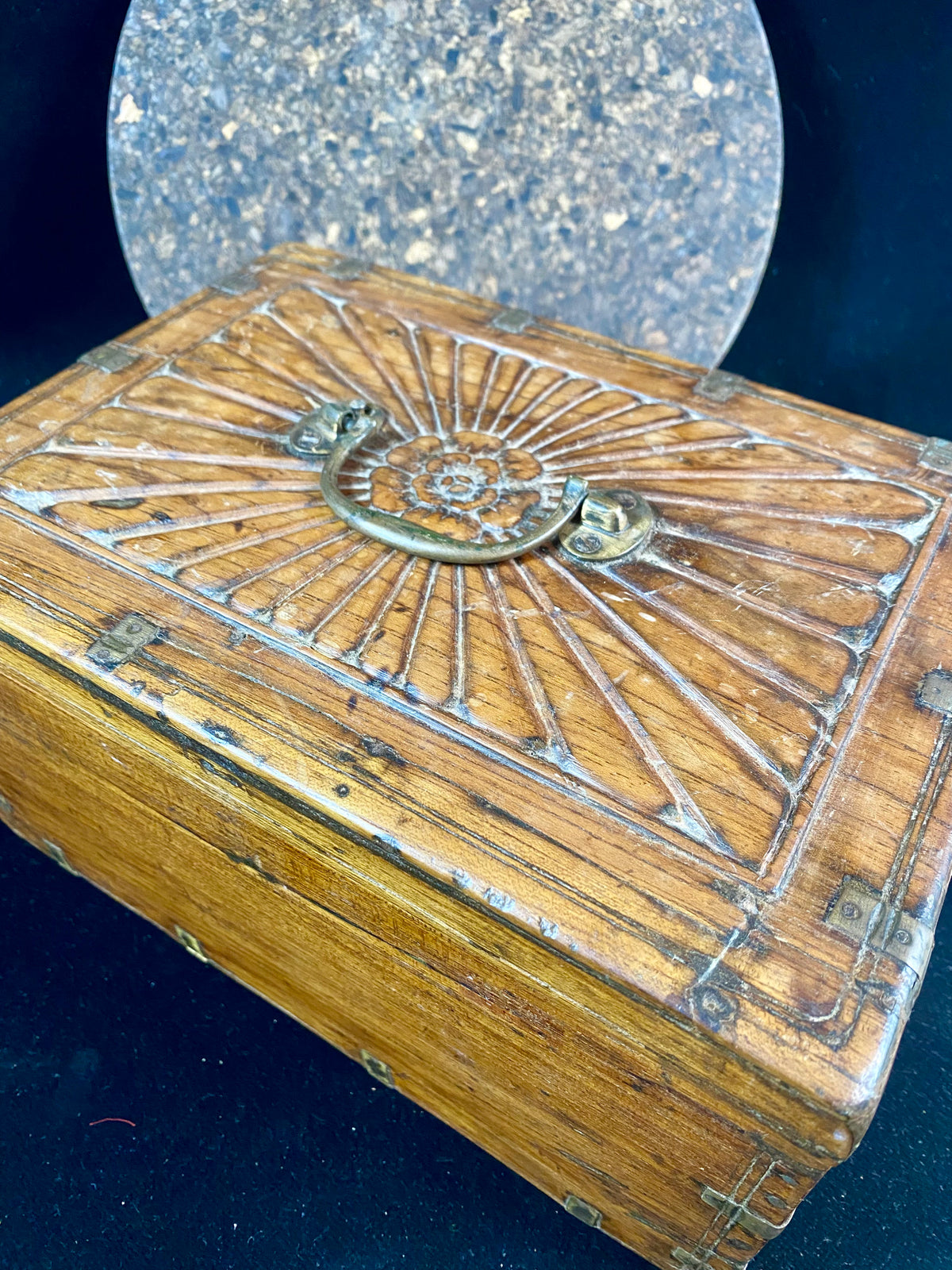 A lovely old southern Indian cash box with carved top and original brass trim, handle and hinges. Fitted with two small shelves inside. Made from teak, this would make a lovely trinket box, key box, jewellery, watch or cufflink box Circa 1880 - 1920. Measurements: length 27.5 cm  x depth 19 cm, height 15 cm.