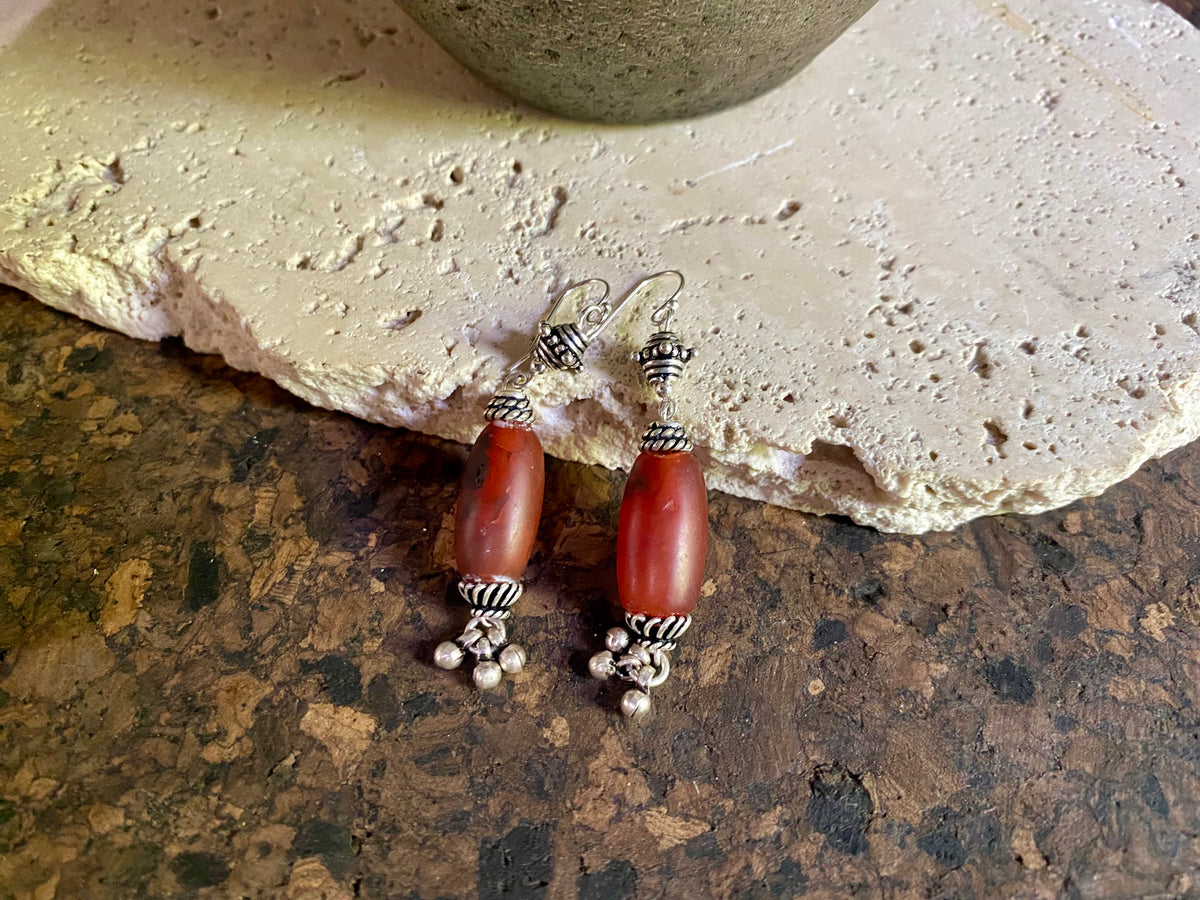 Beautiful long drop earrings combine antique carnelian stones with handmade Indian silver beads and sterling silver hooks. Carnelian stones from Nepal, 5.8 cm length