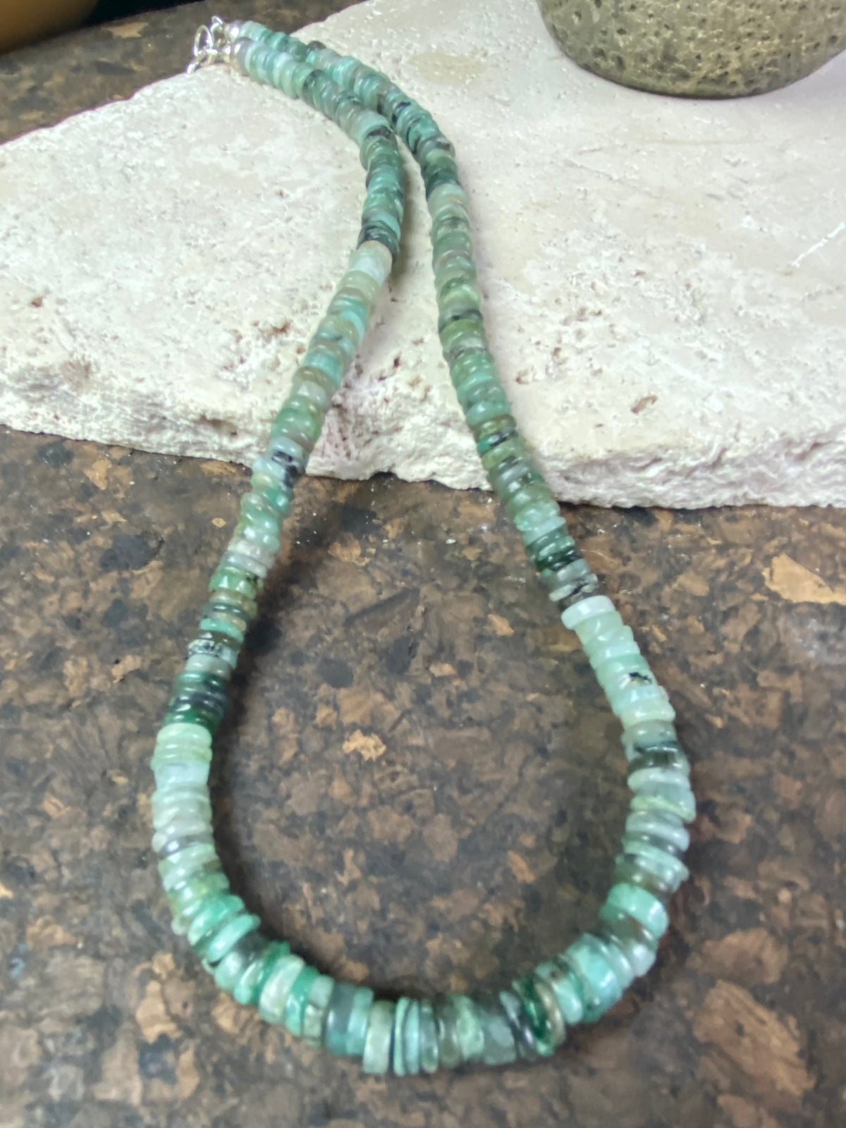 Heshi cut natural emerald necklace features sterling silver findings and a hook clasp.  These colour graduated emeralds are of every imaginable shade of green, ranging from pale to dark, from clear to cloudy. Length 45 cm