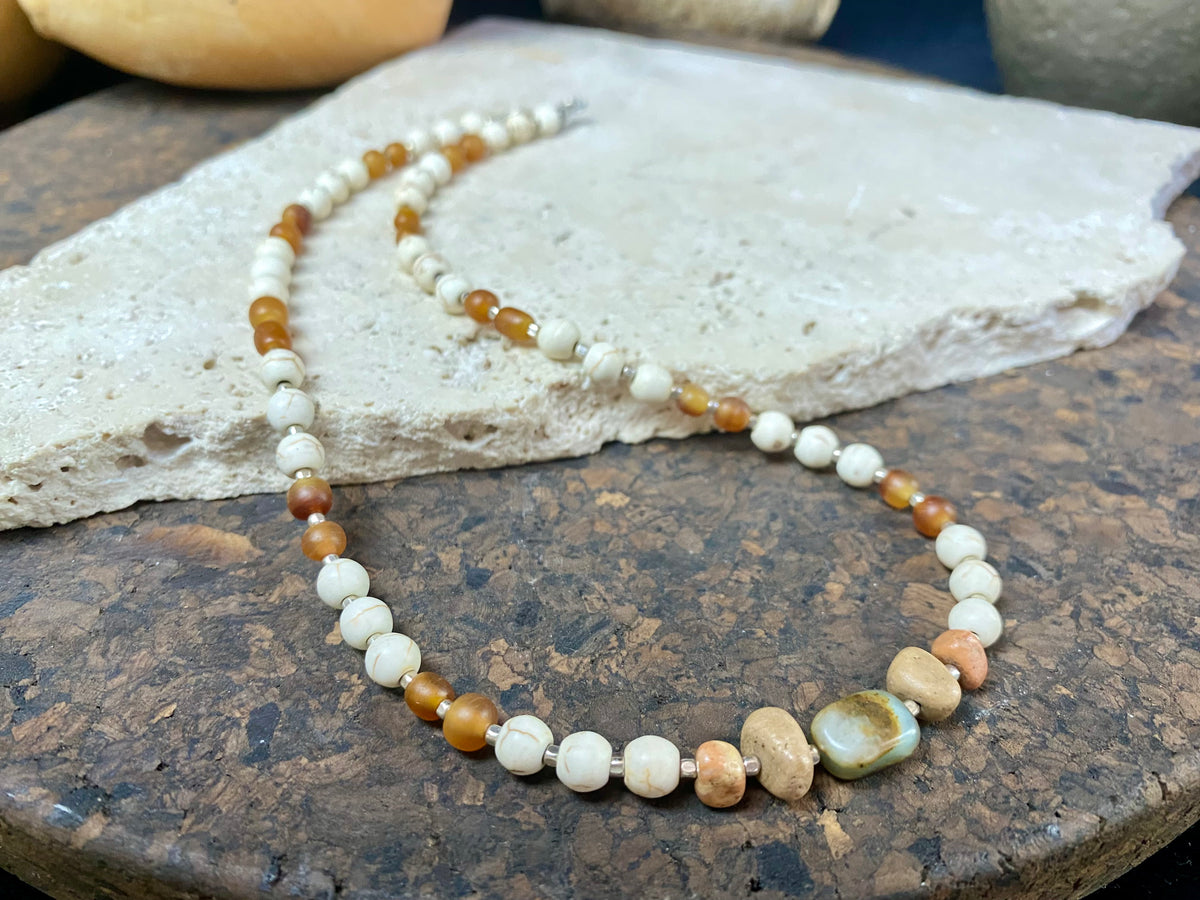 Our unique statement necklace features beautiful vintage beads from the Kashgar collection - turquoise centre bead, jasper beads from the Philippines, howlite beads, buffalo horn beads and  925 sterling silver detailing and lobster clasp. Length 45 cm.