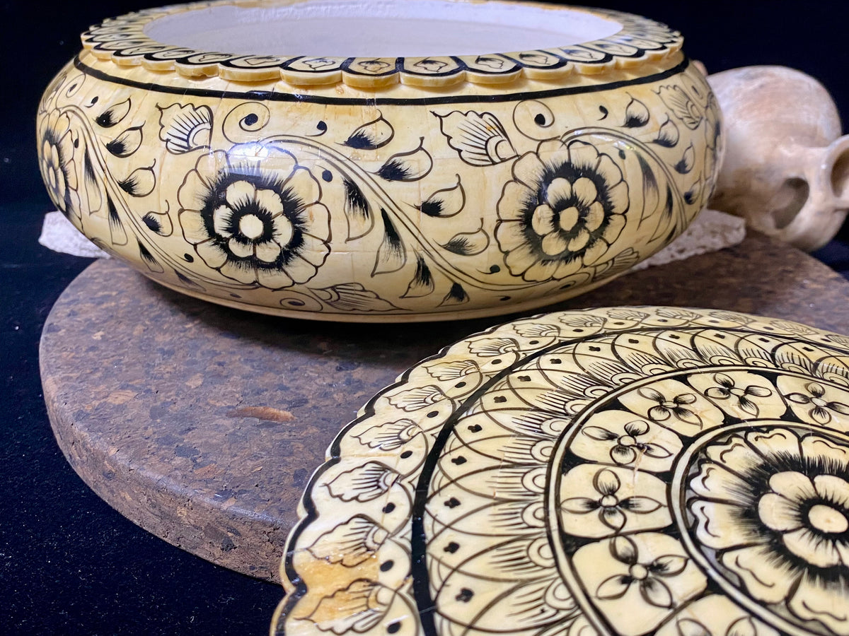 A beautiful low oval lidded bowl or box, traditionally called an opium pot because of its shape. Crafted from hand shaped panels of camel bone over wood, then hand painted. Hand made in Rajasthan, India. Measurements: diameter 24.5 cm, height 10 cm.