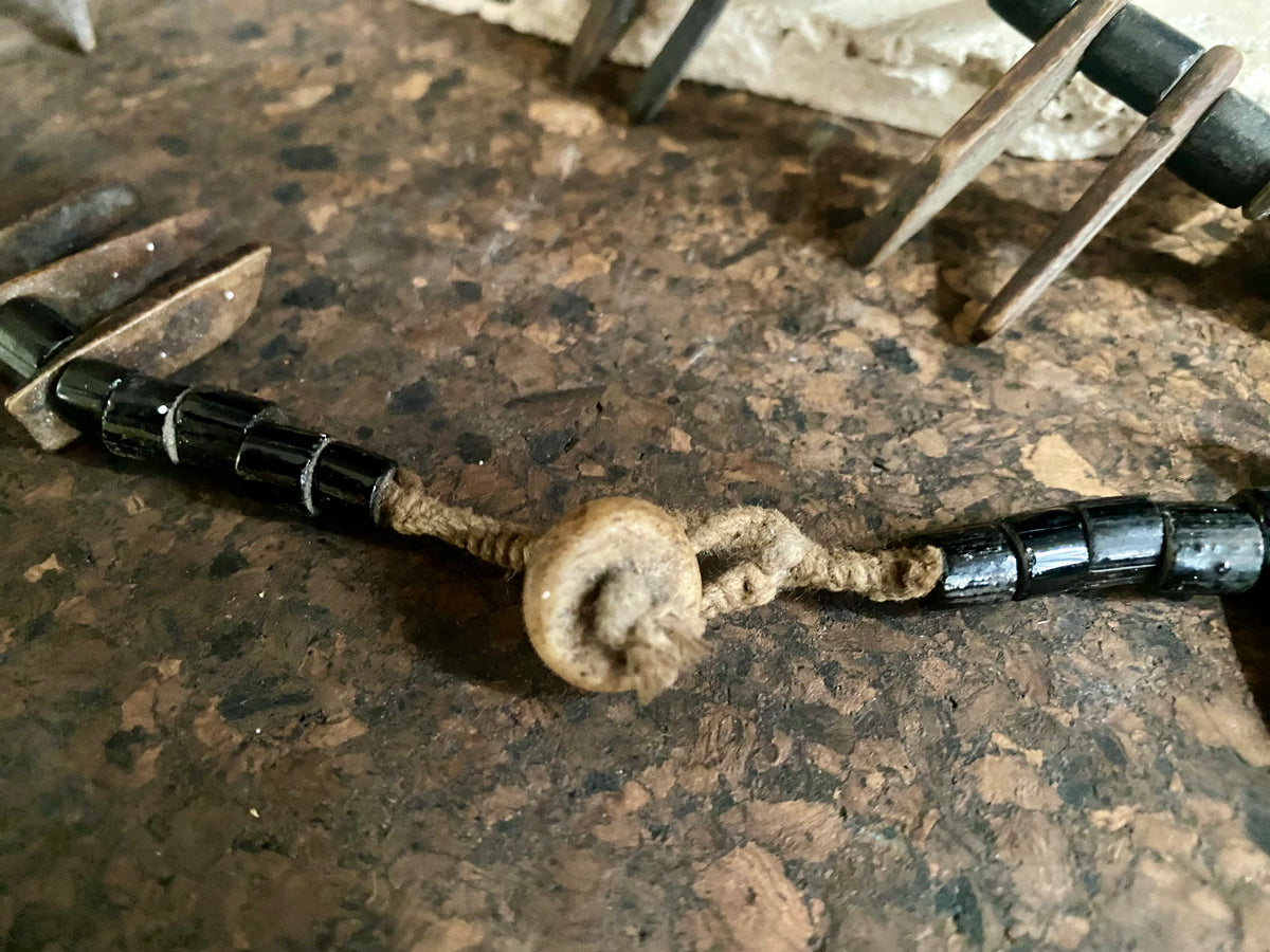 long buffalo tooth and bone necklace. It's made with a combination of buffalo bone, buffalo tooth and ceramic beads. This is a new necklace made in typical Naga tribal style. Length 45 cm