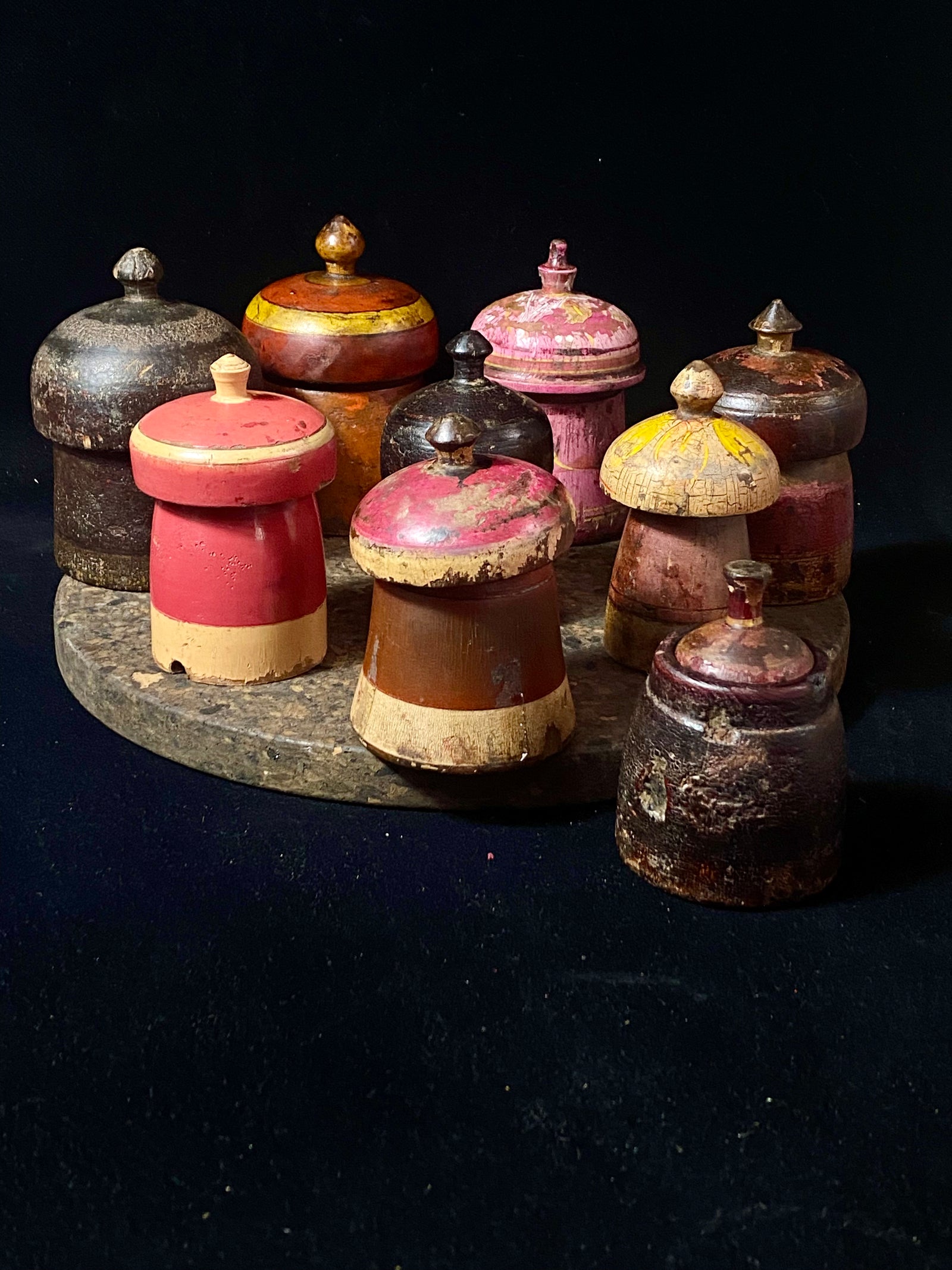 Antique small tikka pots. Hand carved teak, lacquer paint. Approx 50-90 years old. Assorted shapes, sizes and colours. Height approximately 9-12, diameter 6-8 cm