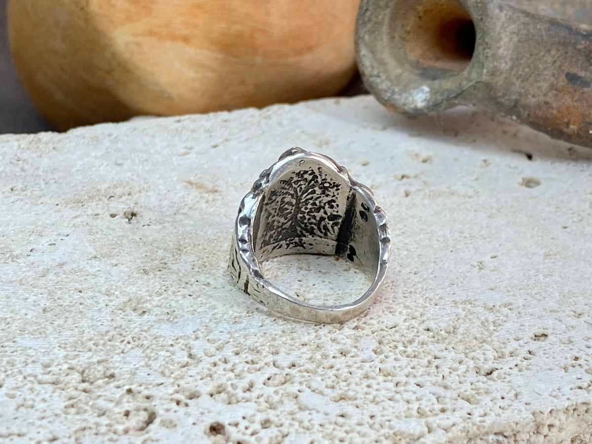 Vintage silver Ganesh ring from Rajasthan, India, weighing over 15 grams. A beautiful depiction of Lord Ganesha with small open piercings to each side of Ganesh and an image of the Tree of Life on the back. This is a stunning silver ring that can worn by men or women. Ganesh: 2 x 1.7 cm Size: 18.25 mm| Size 8