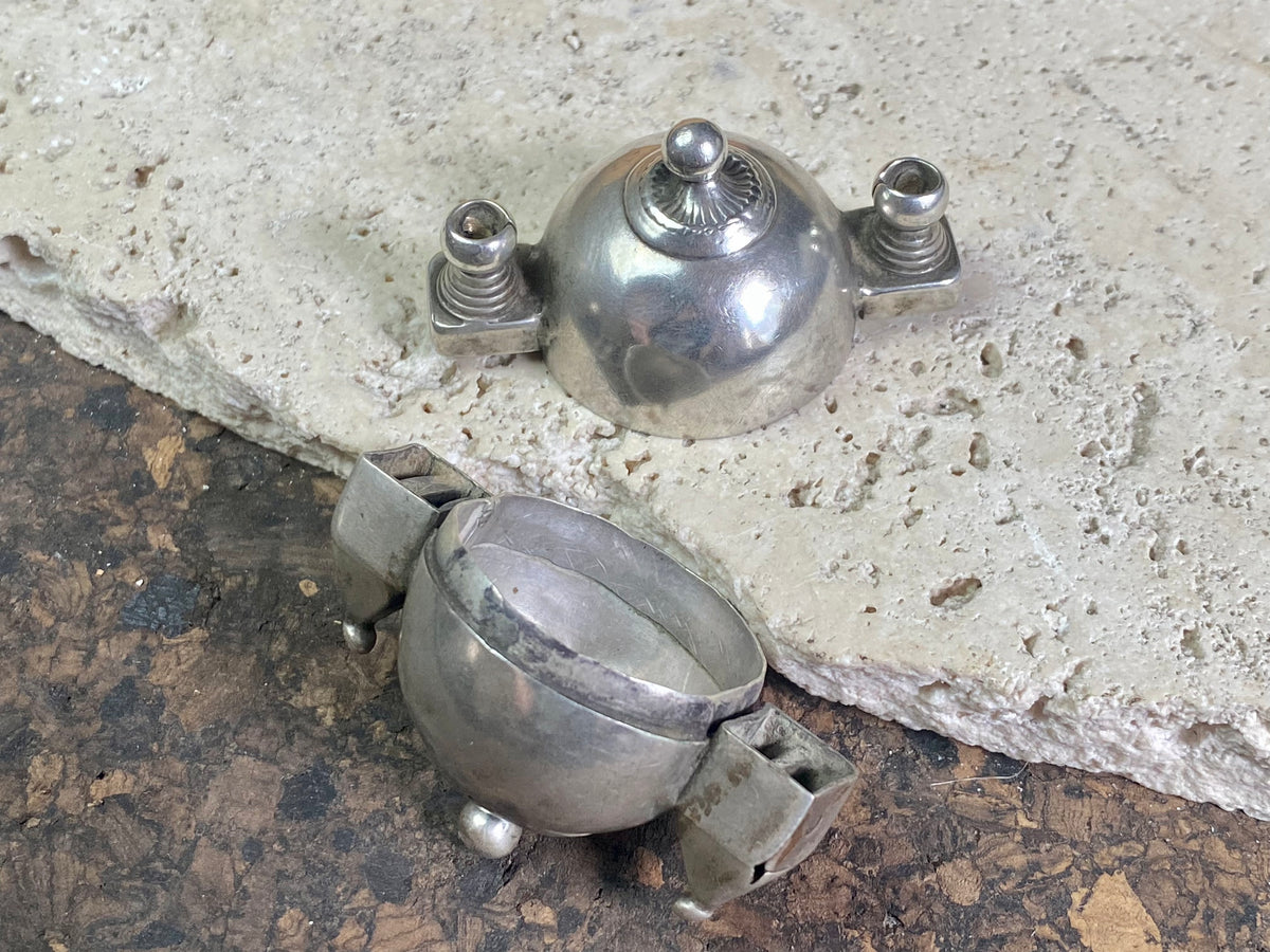 This Shiva lingam box or container is is a fine example of casket workmanship. Dating from the early 20th century or earlier, it is hand cast from high-grade silver & features wear marks commensurate with a piece this age. Measurements: Height 4.8 cm (1.85"), width 5 cm (2")