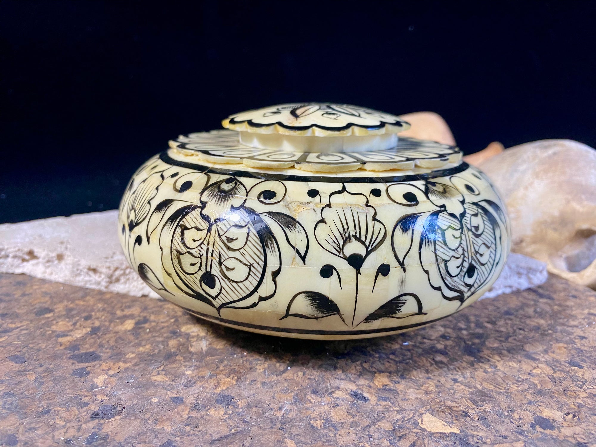 A beautiful low oval lidded bowl or box, traditionally called an opium pot because of its shape. Crafted from hand shaped panels of camel bone over wood, then hand painted. Hand made in Rajasthan, India. Measurements: diameter 15.5 cm, height 6.5 cm. 