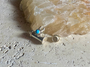 These lovely box pendants open at one end and have plenty of room to place items inside. Two bails complete the look. Sterling silver, finished with a turquoise stone.  Two sizes to choose from