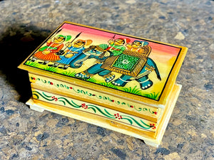 Small perfectly formed trinket or pill boxes, hand crafted from polished hand shaped panels of camel bone, which are then exquisitely hand painted with scenes of elephants. Set on small feet for real elegance. Length  7.5 x 4.5 cm, height 3 cm