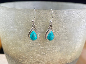 Elegant teardrop shaped earrings with a beautifully detailed bezel to show off the natural beauty of the cabochon stones. Sterling silver hooks complete the look. Our earrings are open-backed to allow natural light to show through. Length including hook 2.7 cm