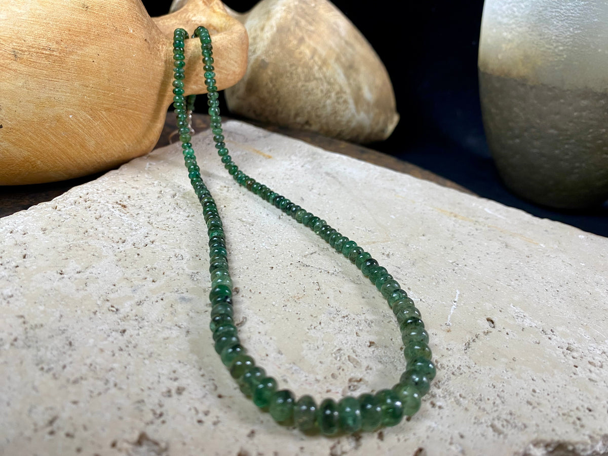 A classic necklace of graduated, matched natural emeralds featuring sterling silver findings and hook clasp. 70 carats of emeralds, length 45.5, bead size 2 mm - 6 mm