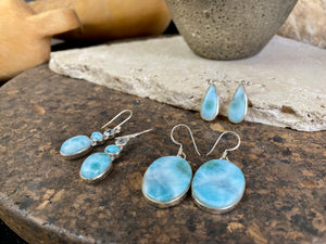 Larimar stone earrings set in sterling silver. Each pair of earrings is unique, cut and mounted to showcase the beauty of the individual stones.