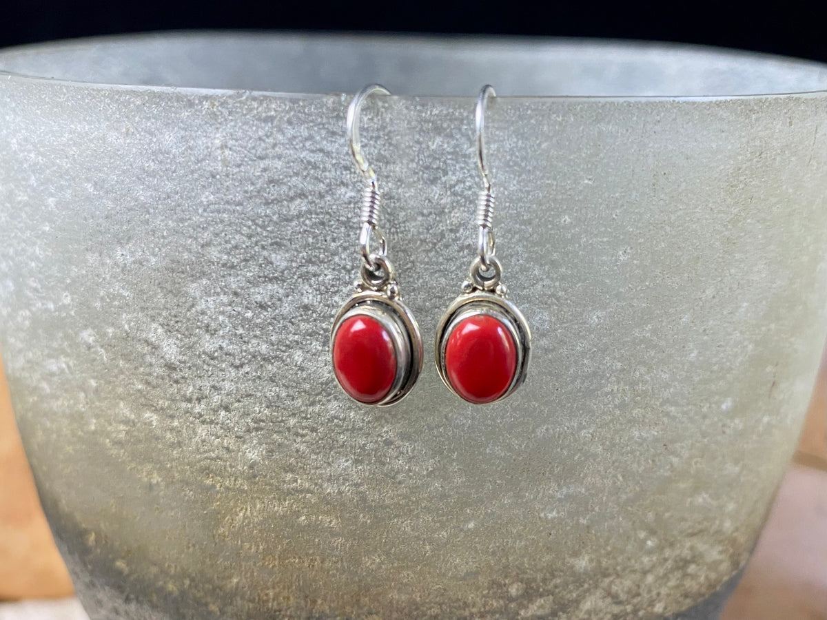 Simply elegant oval earrings with a small shadow box bezel to show off the beauty of the natural cabochon gemstones. Sterling silver hooks complete the look. Our earrings are open-backed to allow the light of the stones to show through. Length including hook 2.5 cm