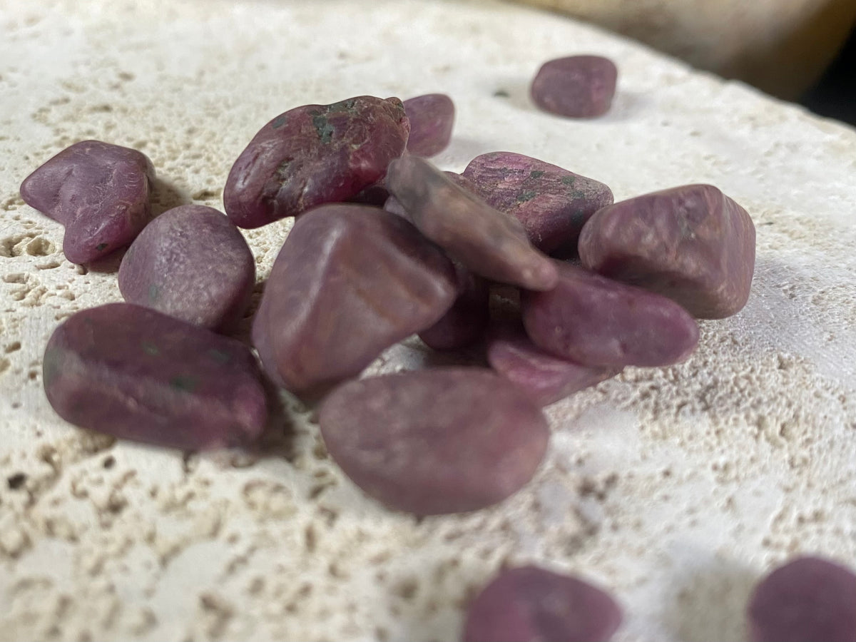 Natural rubies. Uncut and unpolished. Each ruby is unique and will bring its own character to your crystal collection. Approximate size of each stone  Large: between 2 and 3 grams. length around 1.5 cm Small: between 1 and 2 grams, length around 1 cm Select your preferred size from the drop down menu. Price is per single piece and we will select a piece to send you.