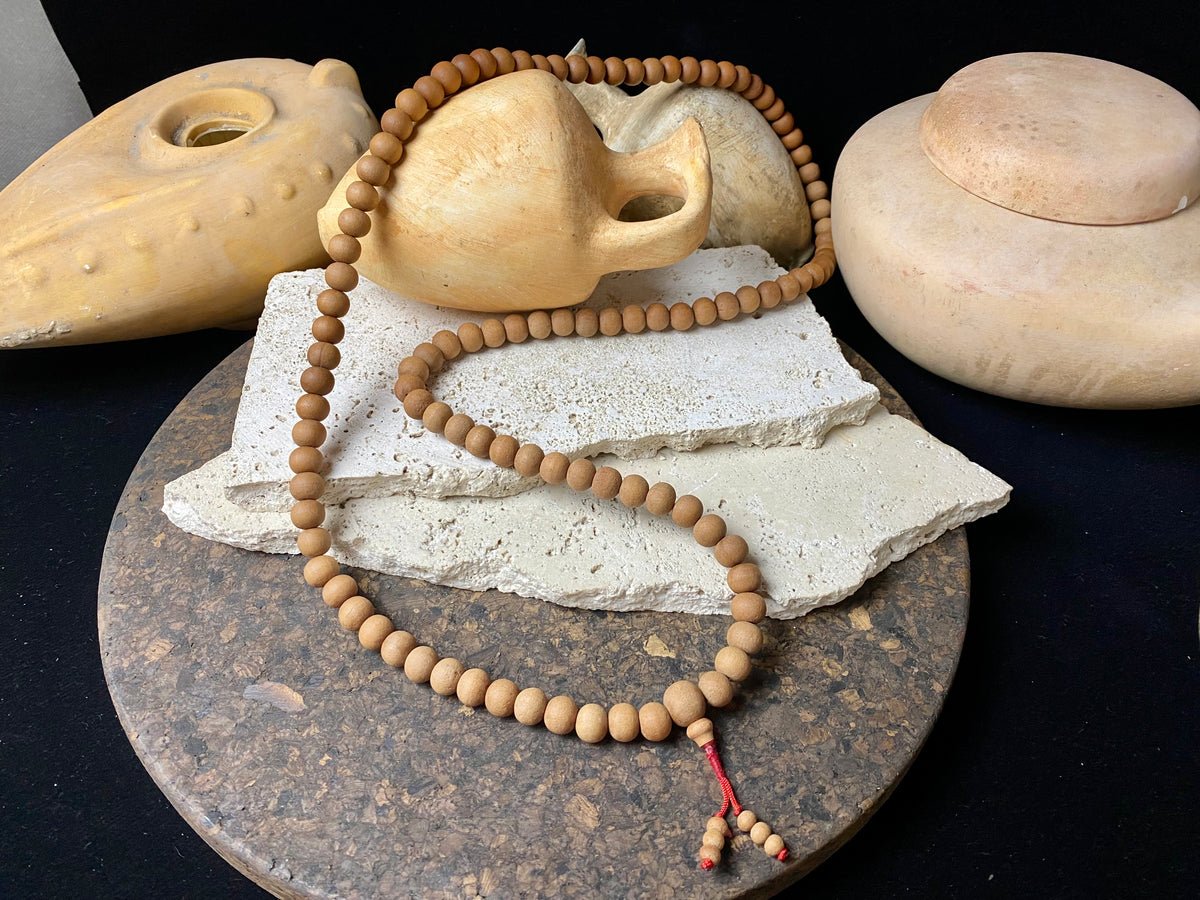 Women or men’s Buddhist mala necklace. Natural sandalwood, 108 beads. Total length 96 cm. Sandalwood beads are 8 mm diameter