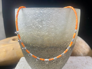 Fine cut beads of bamboo coral, highlighted with traditional handmade sterling silver Rajasthani ball beads. Finished with sterling silver findings and hook clasp. Designed to be unisex, this necklace would look stunning on men and women. Measurements: 41 cm (15.85")