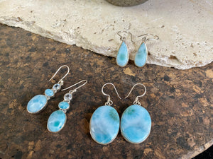 Larimar stone earrings set in sterling silver. Each pair of earrings is unique, cut and mounted to showcase the beauty of the individual stones.