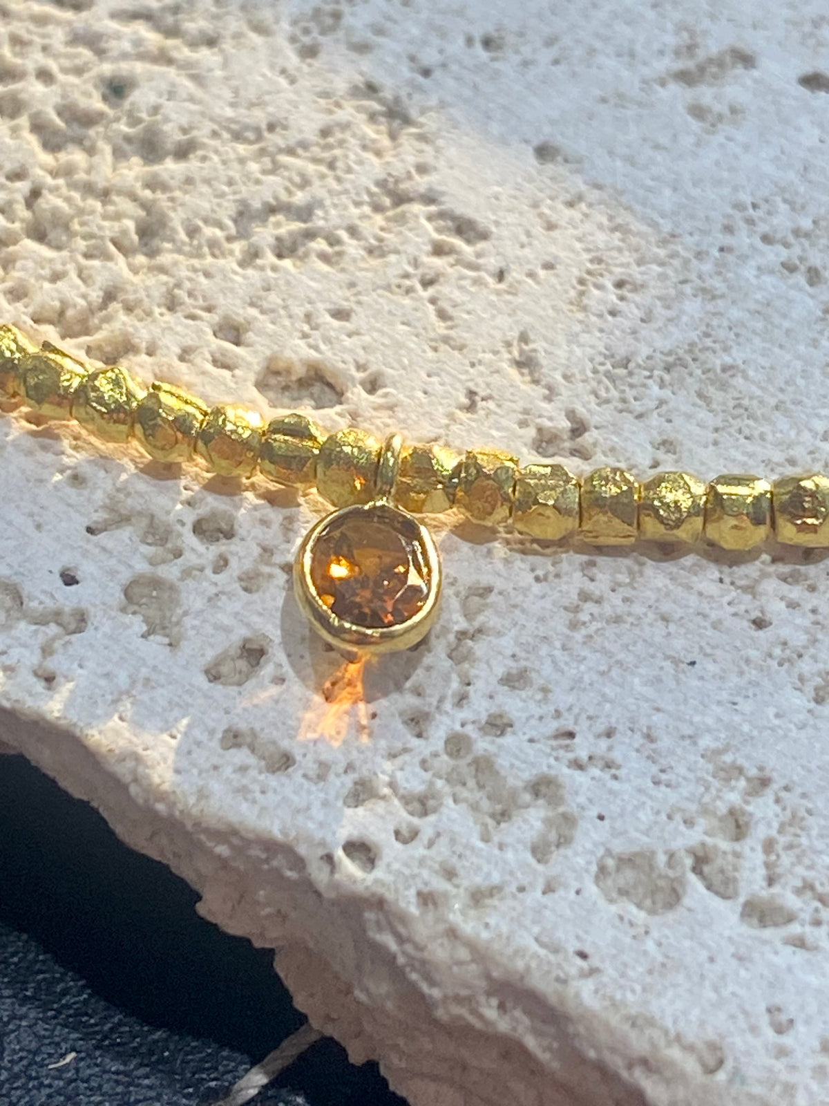 Vibrant gemstones adorn this elegant multi charm necklace. Plated 22k gold over brass, the multicoloured gemstones are evenly spaced and bezel-set to highlight the beauty of each gemstone. This necklace is designed to be worn short, but comes with an extension chain so you can set the length according to your neckline. Measurements: length 41 cm, with extension chain 45.5 cm