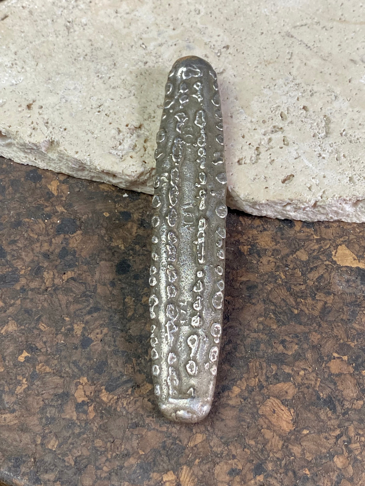 Silver 1.5 Tamlung Lat (short for talat, or currency), often called tiger tongue money, with 3 na (snake) marks. Circa 1591-1707. Laos Vientiane.  This is a hand poured silver ingot with its original patina. Length 11.8 cm