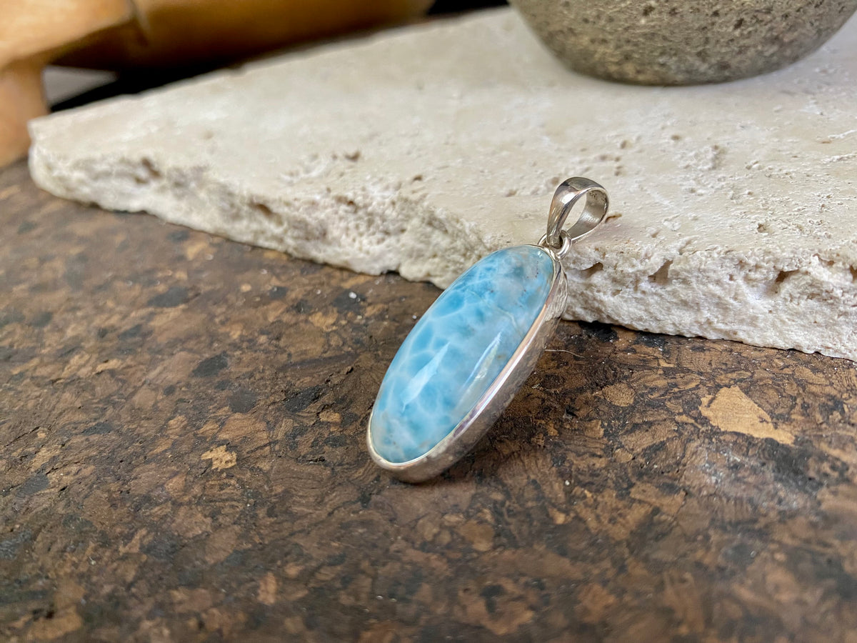 Larimar stone pendants set in sterling silver. Each pendant is unique, cut and mounted to showcase the beauty of the individual stones.