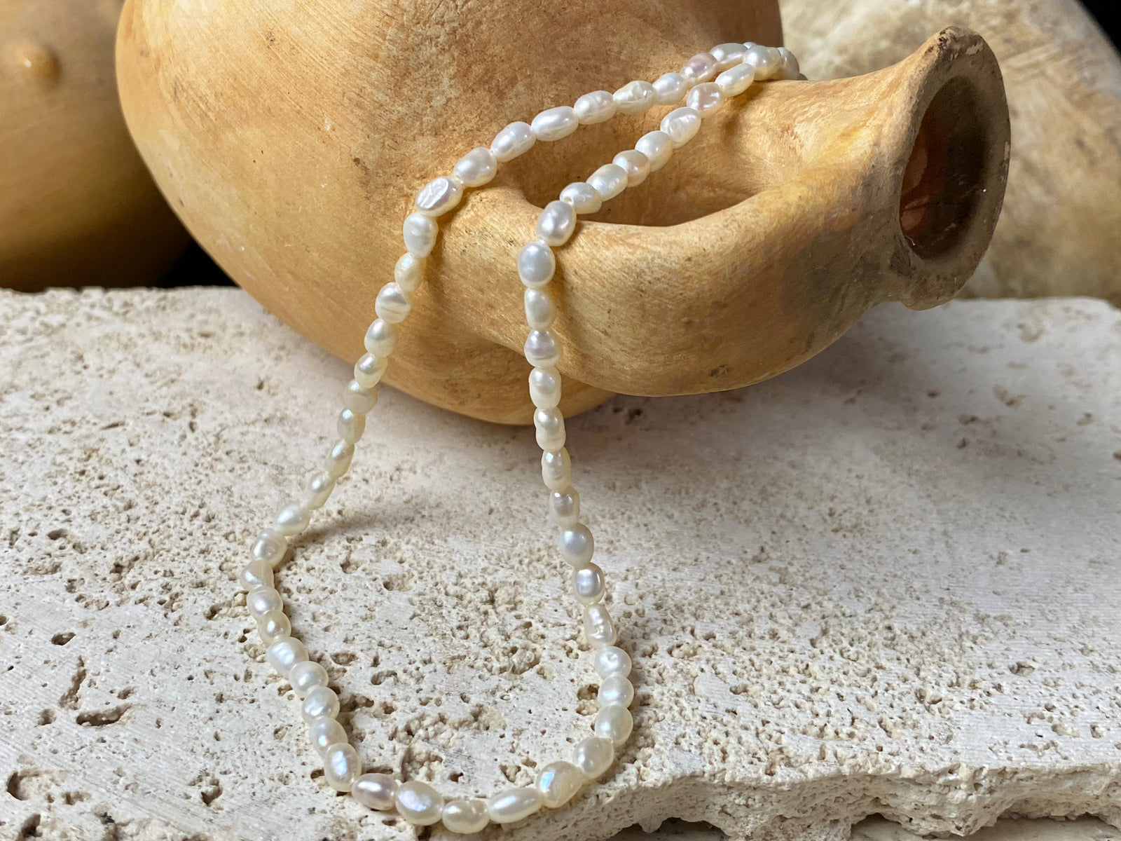 A simple pearl choker necklace, finished with a brass barrel clasp.  These are cultured freshwater pearls.  Measurements: length 38 cm including clasp 