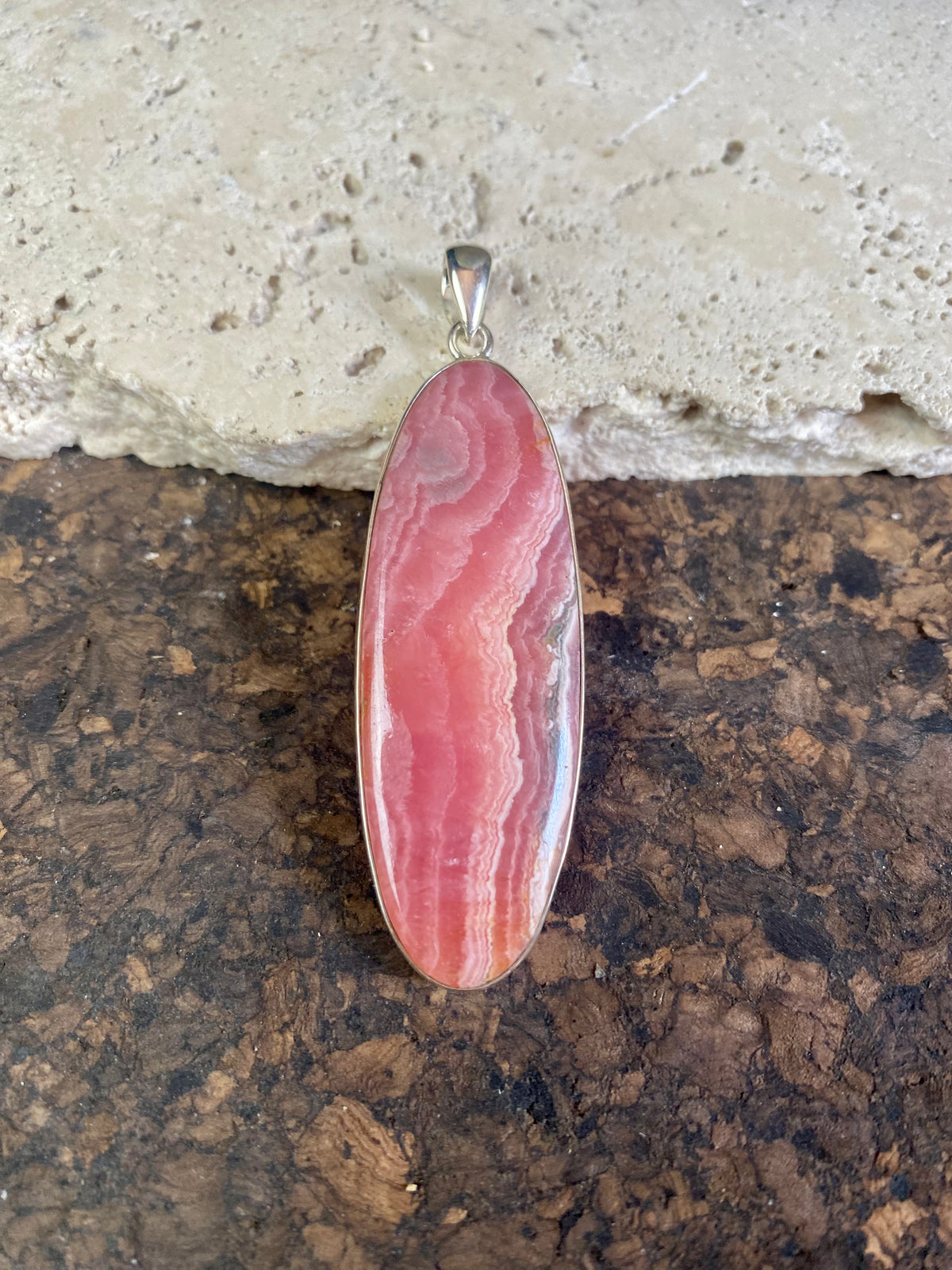 The most beautiful rhodochrosite we've ever seen. Every piece tells a story, all set in sterling silver bezels with generous bails to take the largest of chains or cords. These are beautiful statement pieces of jewellery.