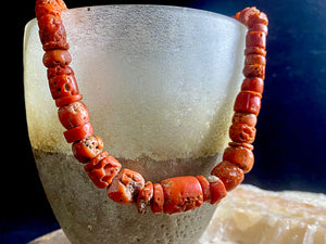 A stunning necklace of graduated antique red coral from the Himalayas, purchased in northern Thailand in 2004 and finished with a sterling silver clasp. This strand has 88 beads including a magnificent centre bead and weighs 55 grams. Length 45.5 cm