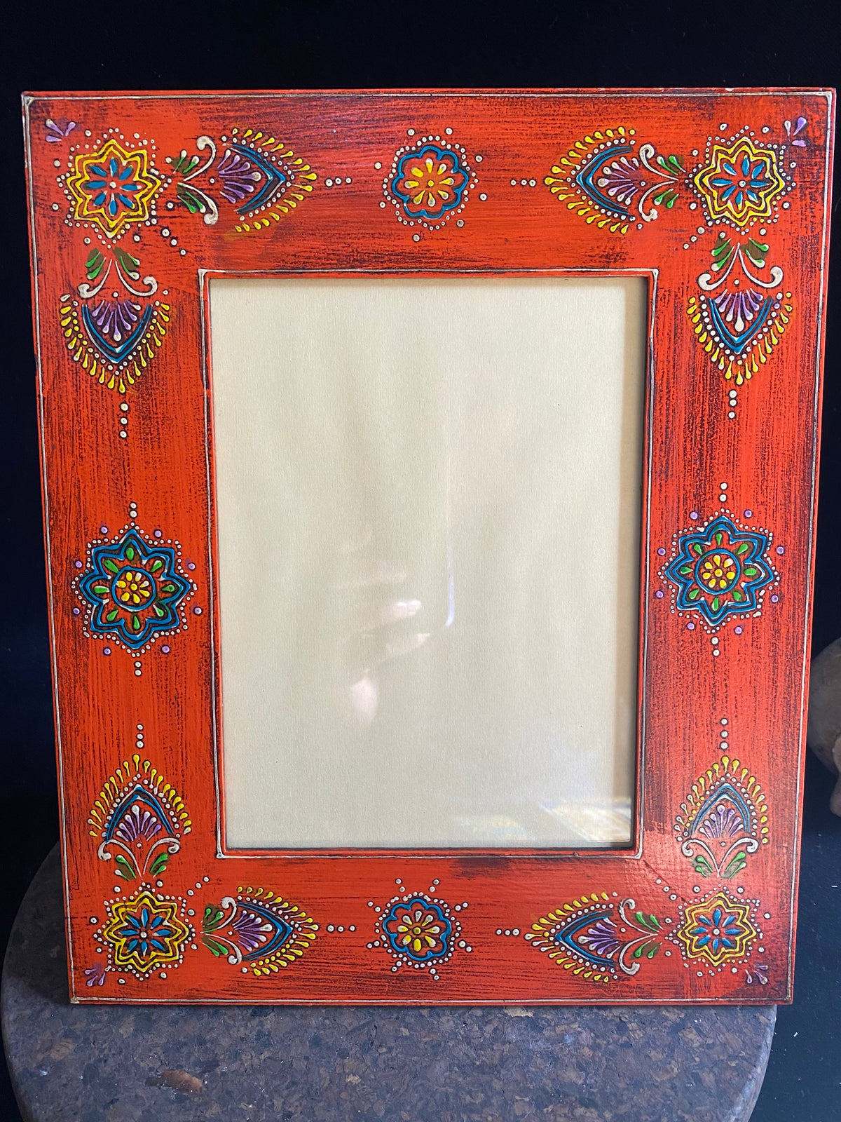 <p>Bright, hand painted picture frame with glass inset window. Set it vertically or horizontally depending on the size of your picture. Hand made in India.</p> <p>Measurements: Outside frame 25 x 20 cm, inside window 14 x 9 cm</p>