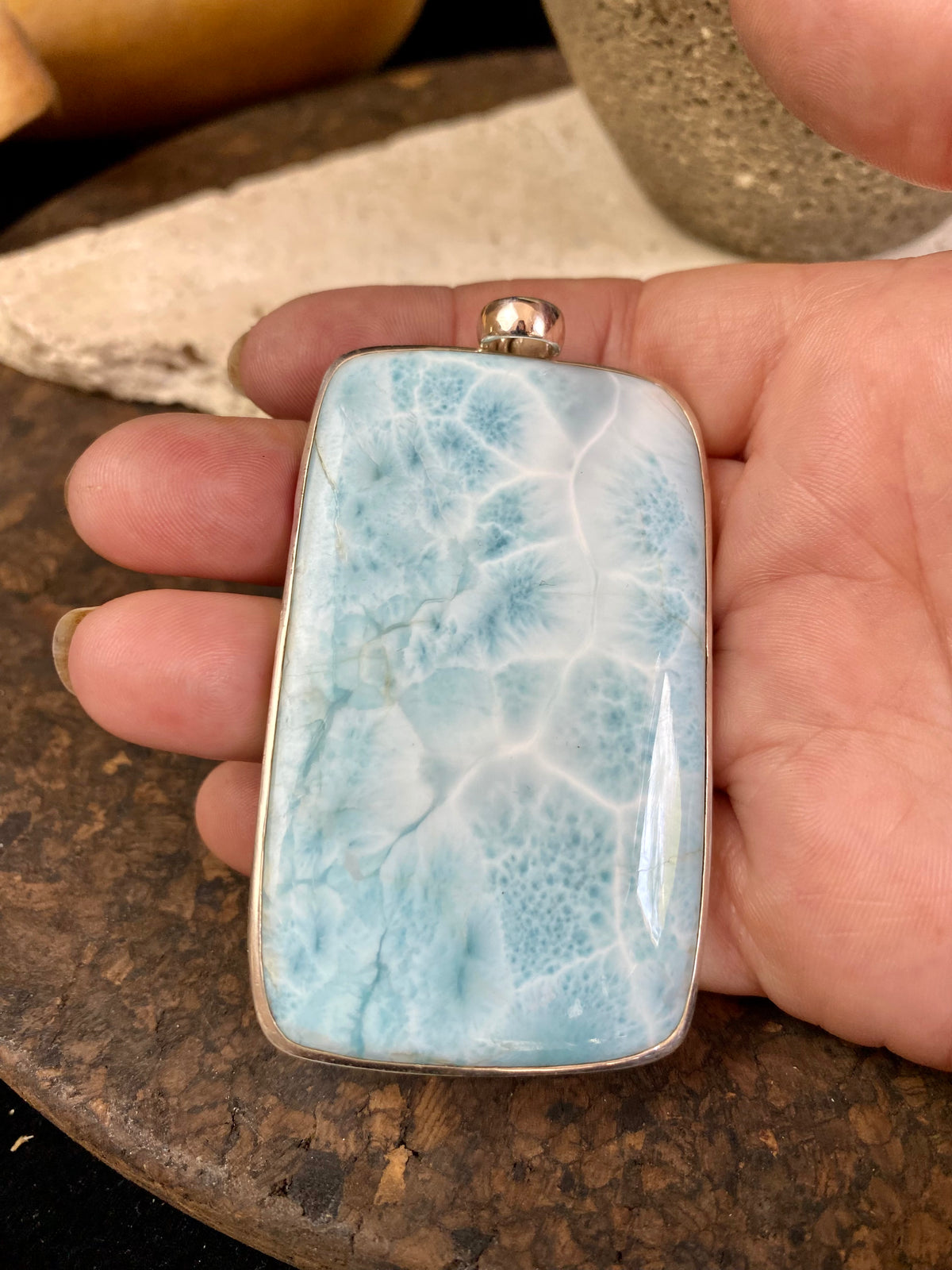 Larimar stone pendants set in sterling silver. Each pendant is unique, cut and mounted to showcase the beauty of the individual stones.