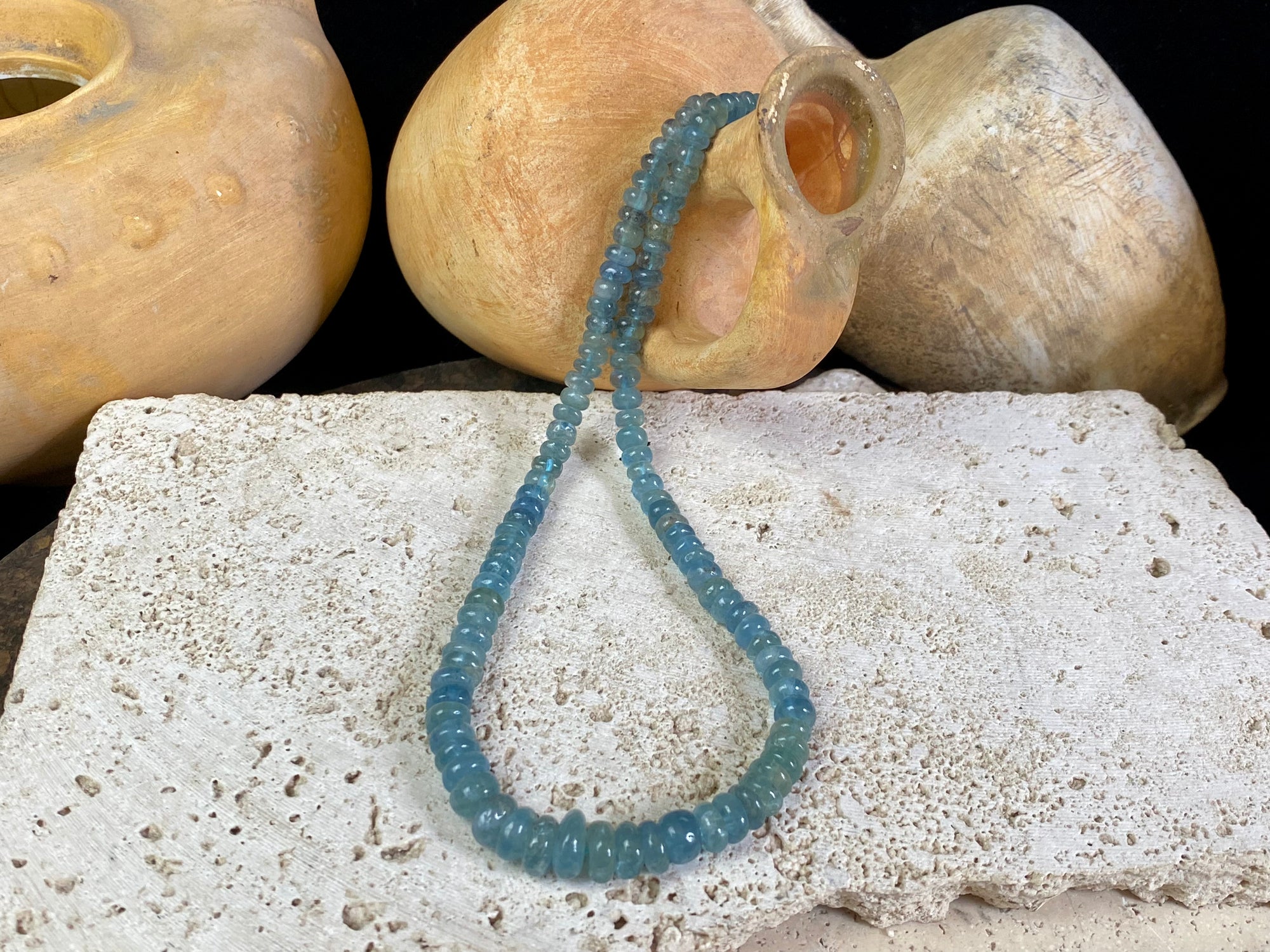 Natural aquamarine necklace featuring rondel cut graduated aquamarine. Sterling silver hook and ring clasp. The aquamarine beads are matched, graduated, 100% natural, of a deep cloudy sea blue. Measurements: 41.5 cm