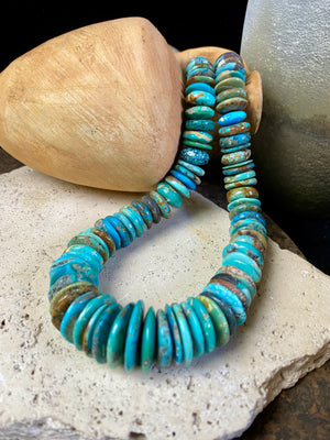 Stunning bright blue Arizona turquoise necklace featuring graduated disks of Arizona turquoise finished with sterling silver. Length 47.5 cm