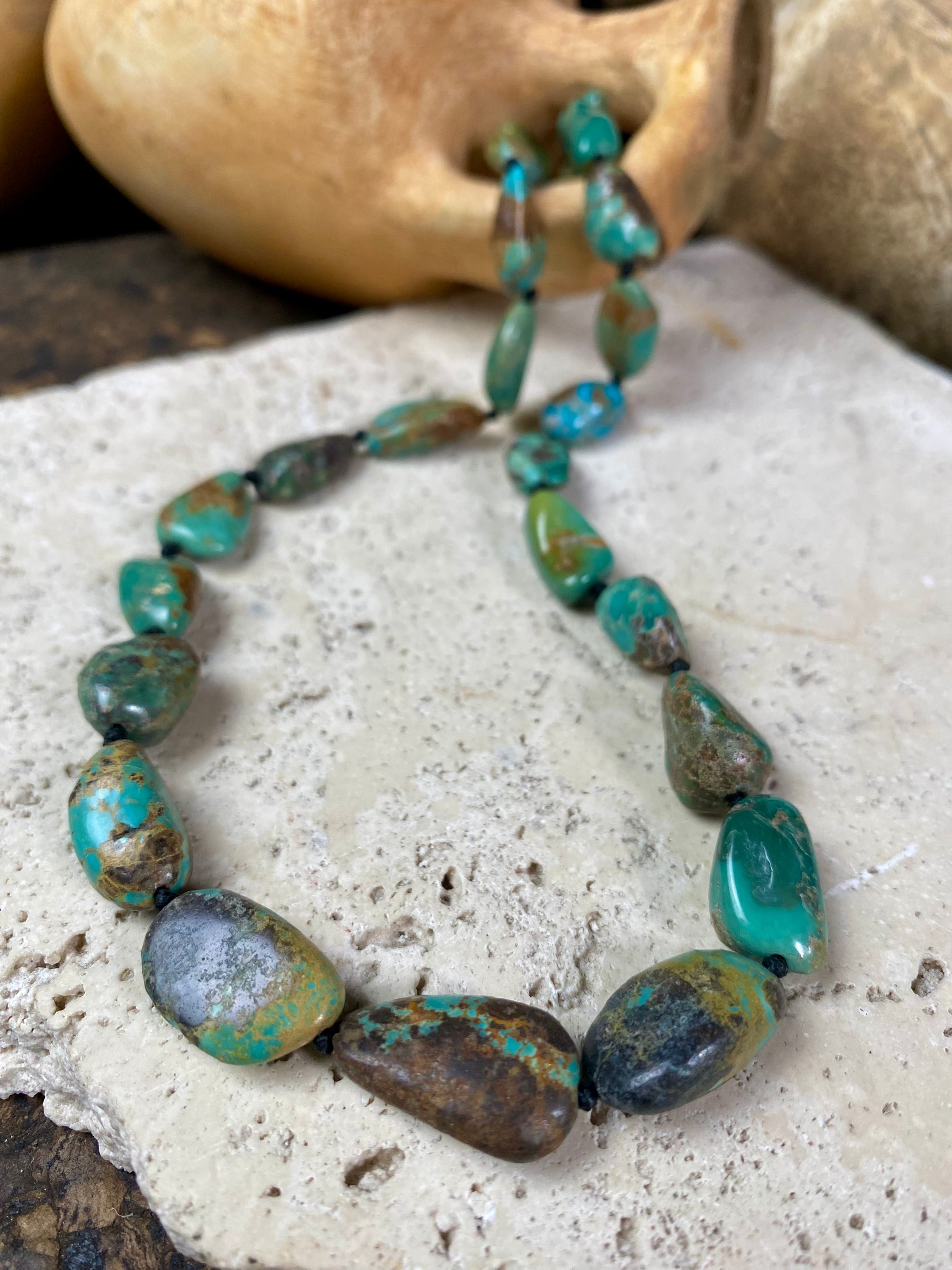 Tibetan turquoise necklace. Knotted between each bead and finished with sterling silver clasp. length 46.5 cm