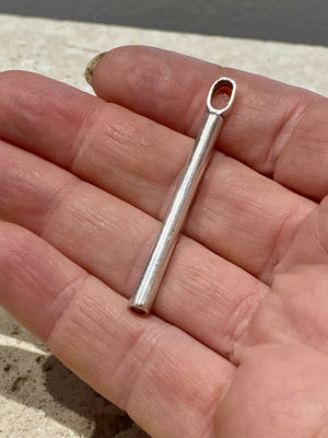 Elegant stick pendant in sterling silver with a generous bail to take even the largest of chains or cords. This is a unisex pendant and can easily be worn by both men and women  Measurements: length including bail 5 cm, width 3 mm